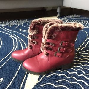 Leather boots with soft fur and buckles and straps